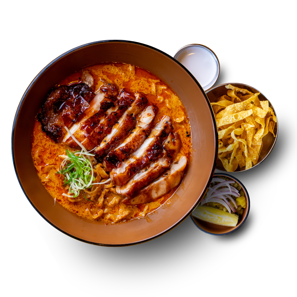 Khao Soi grilled chicken in coconut curry broth with soft egg noodles