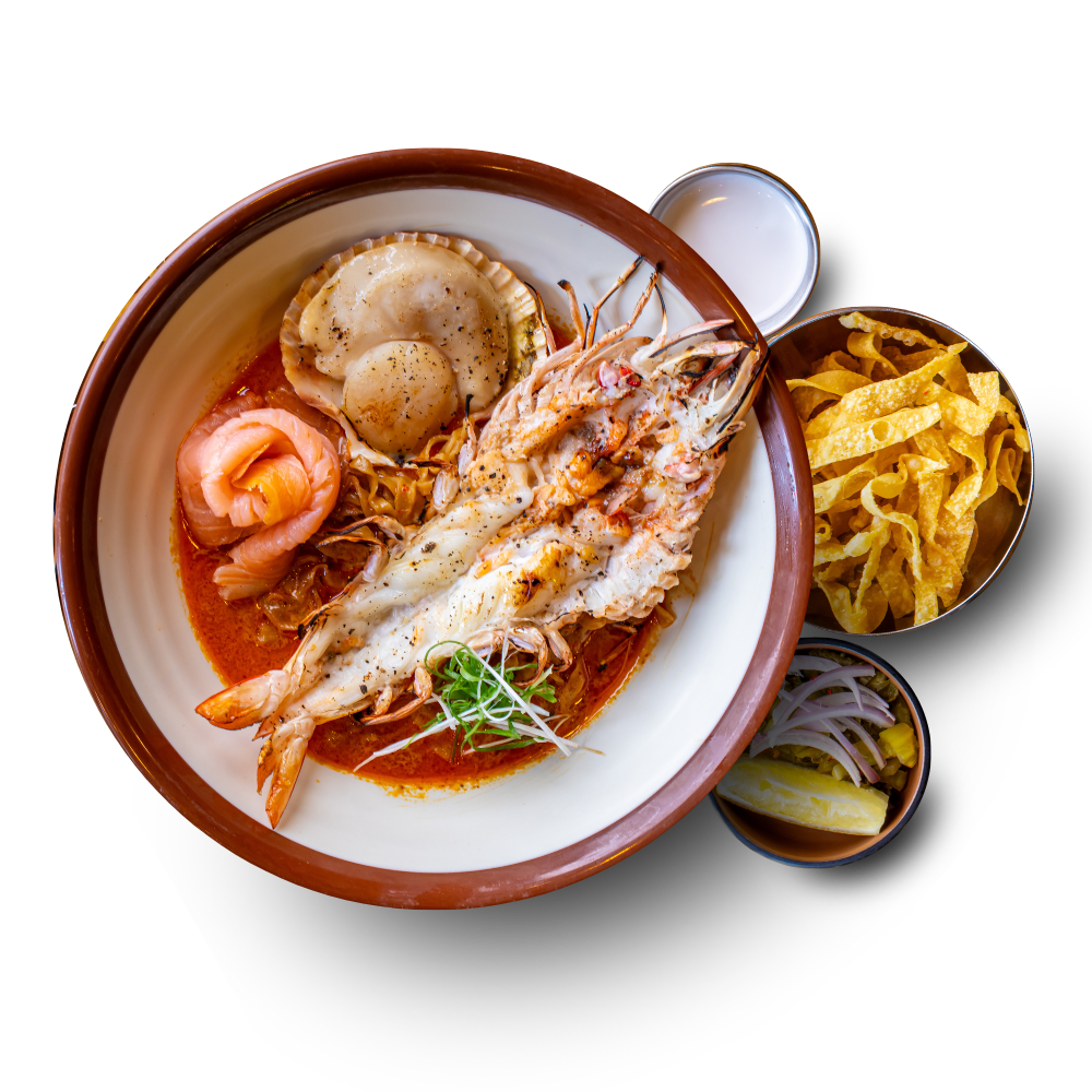 Khao Soi seafood — charred king prawn, scallop and salmon in coconut curry broth
